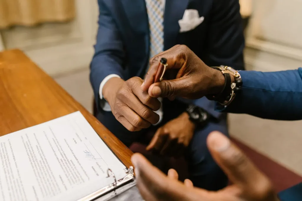 Register private limited company SECP Pakistan — business partners signing company documents